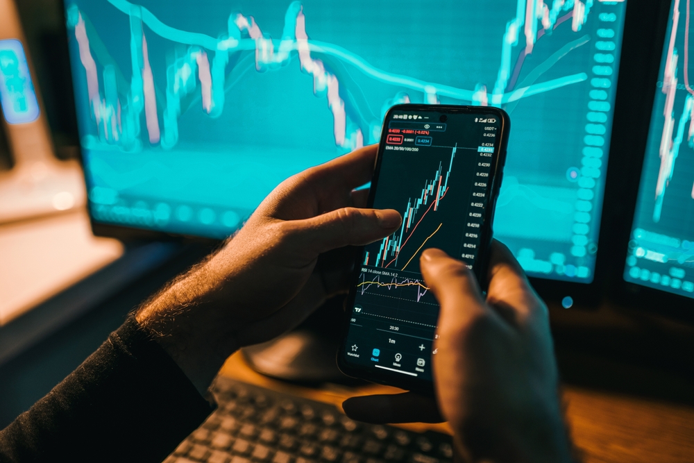 A day trader monitoring his trade